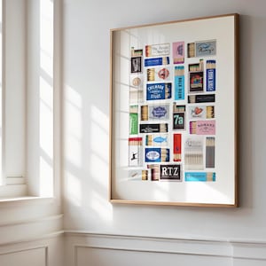 May include: A framed collage of vintage matchbox labels, featuring a variety of designs and colors. The labels include names like "The Rovers", "Gillmark", "Seafoods Delights", "7a", "Nomans", "Raw", "RTZ", and "The First Hunter".