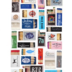 May include: A collection of 20 matchboxes with various designs and names. The matchboxes are arranged in a grid pattern on a white background. Some of the matchboxes feature text such as "The Newes from America", "CHILMARK", "BACK DOOR", "STATE ROAD", "mad, martha's", "The SEAFOOD SHANTY", "7a FOODS", "NOMANS", "19 RAW OYSTER BAR", "COOP DE VILLE", "RTZ artha's vineyard", and "THE PORT HUNTER".