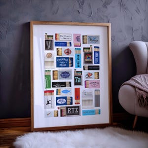 May include: A white background with a collection of matchboxes arranged in a grid pattern. The matchboxes are from various businesses and locations, including The Newes from America, Atlantic, Chilmark General Store, Back Door, Kancy's, State Road, Seafood Sanity, 7a Foods, My Salad, Nomans, 19 Raw, The Back Dog Inn, Coop de Ville, RTZ, and Port Winter.