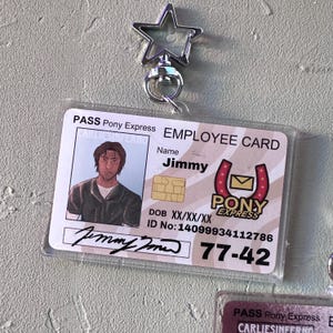 May include: Clear plastic employee ID card with the name "Jimmy" and "Pony Express" logo. The card has a photo of a person and a star-shaped keychain attachment.