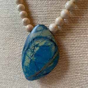 River stone and azurite pendant