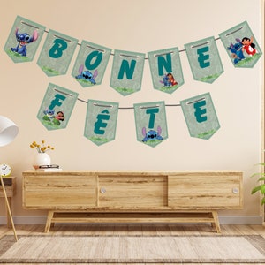 May include: A green and blue banner with the words "BONNE F&Ecirc;TE" and images of Stitch and Angel from the Disney movie Lilo & Stitch.