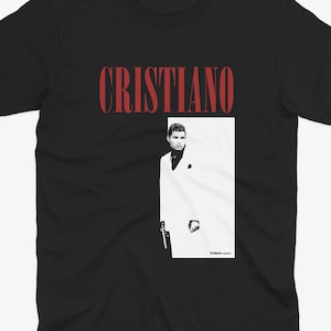 May include: Black t-shirt with a red "CRISTIANO" text and a black and white image of a man in a white suit.