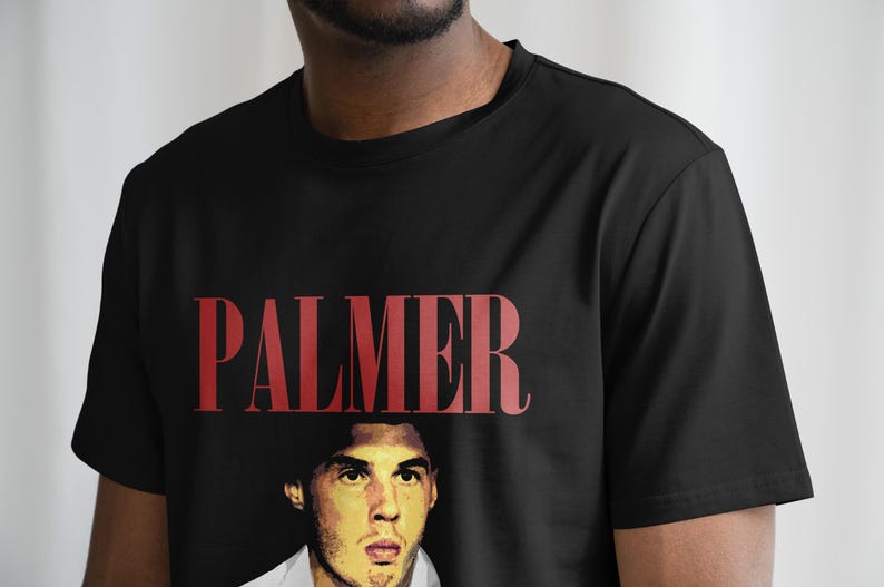 May include: Black t-shirt with a red "PALMER" graphic and a portrait of a man in the center.