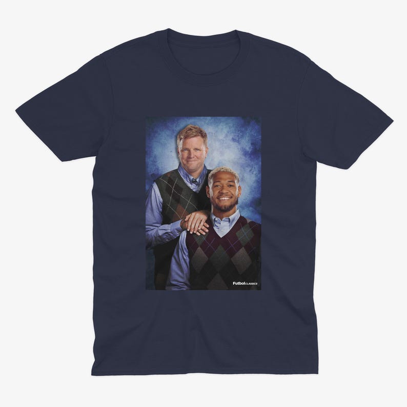 May include: A navy blue t-shirt featuring a photo of two men wearing sweaters. The men are standing next to each other and smiling. The text "Full House Classics" is printed on the bottom of the photo.