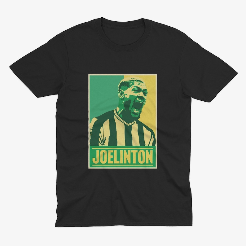 May include: A black t-shirt with a retro-style graphic of a soccer player with the text "JOELINGTON" in yellow.