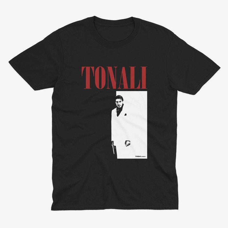 May include: Black t-shirt with a red "TONALI" text and a black and white image of a man in a white suit.