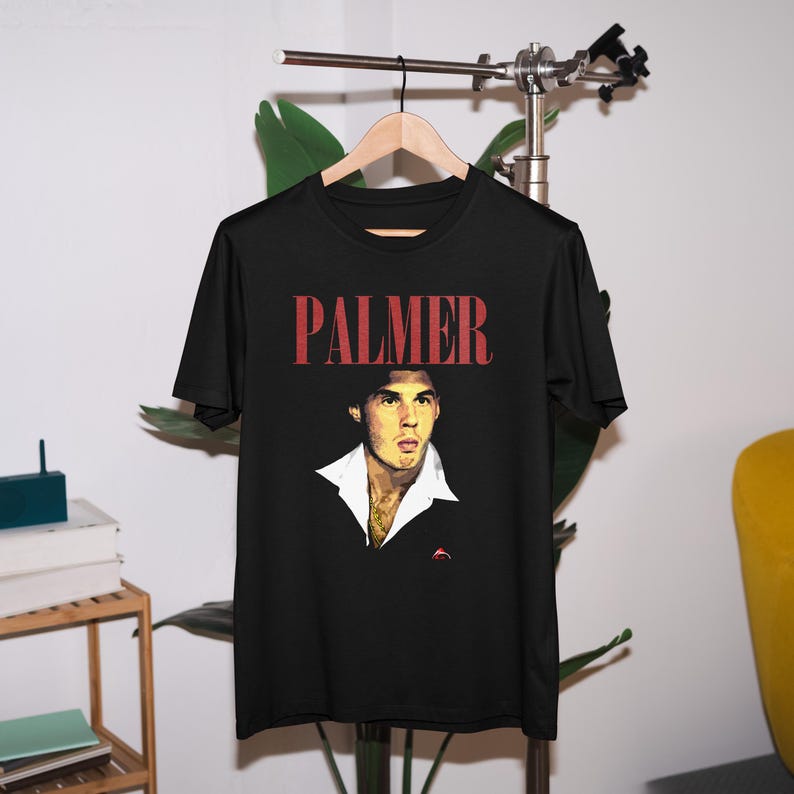 May include: Black t-shirt with a red "PALMER" text and a vintage-style image of a man with a white collar.
