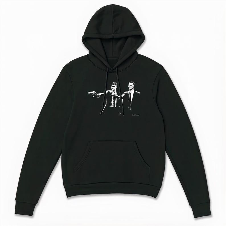 May include: Black hooded sweatshirt with a front pocket and a drawstring. The sweatshirt features a black and white graphic of two men in suits pointing guns. The graphic is centered on the chest.