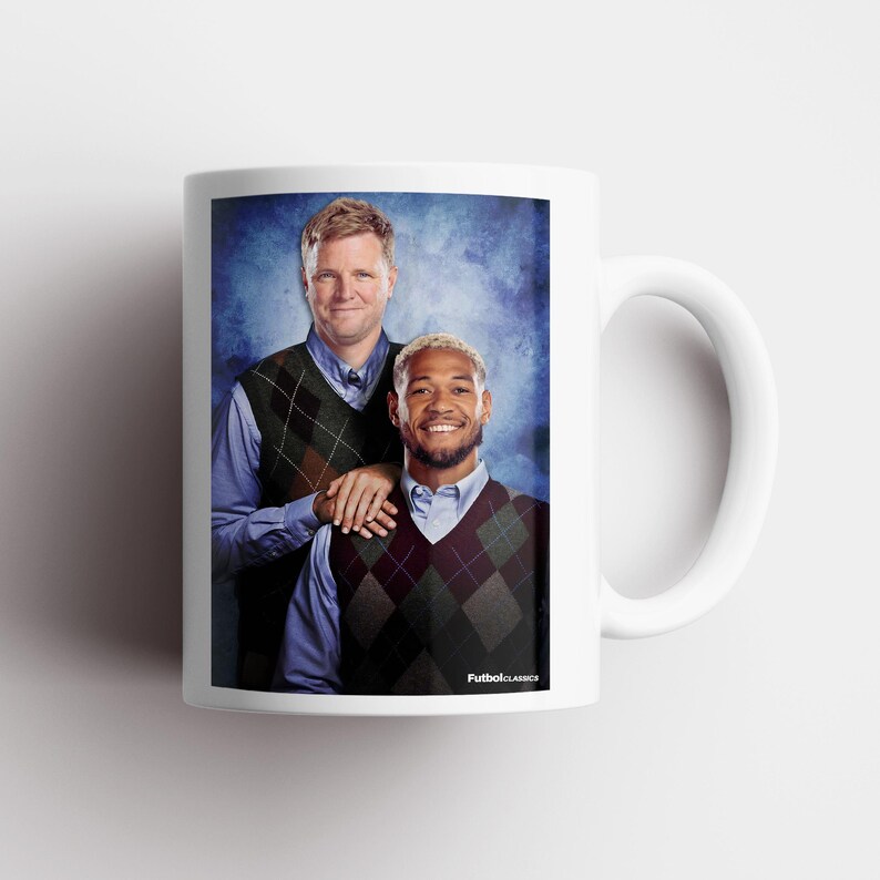 May include: White ceramic mug featuring a humorous image of two men in argyle vests and collared shirts. The mug has a white handle and the text "FutbolClassics" is printed on the bottom right.