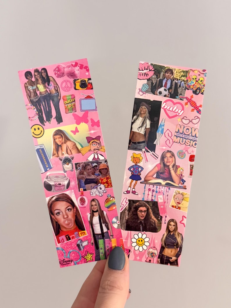 May include: Two pink bookmarks decorated with images of pop culture icons, including singers and cartoon characters. The bookmarks have a collage design with various images and text, creating a nostalgic aesthetic.
