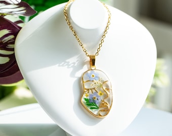 Collar de flores de nomeolvides con cara abstracta, conjunto de joyas de resina con flores, collar de flores prensadas hecho a mano, regalo de Navidad, regalo de graduación