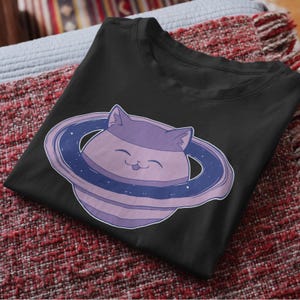 Saturn Cat Unisex Tee, Cute Space Kitty T-Shirt, Galaxy Feline Shirt, Astronaut Cat Graphic Top, Planet Cat Apparel