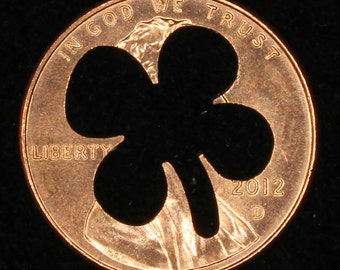 Lucky penny with four leaf clover cut out