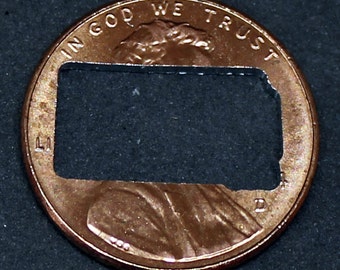 Lucky penny with South Dakota cut out