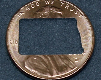 Lucky penny with North Dakota cut out