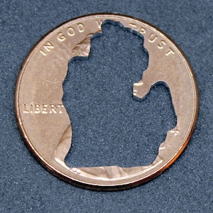 Lucky penny with Michigan cut out