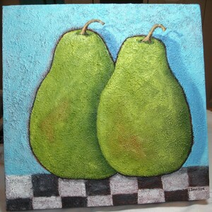 May include: A square canvas painting featuring two green pears with brown stems against a textured light blue background. The pears rest on a black and white checkered pattern. The artwork is signed in the lower right corner.