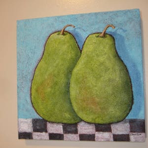 May include: A square painting features two green pears with brown stems against a textured blue background. The pears rest on a black and white checkered pattern. The artwork has a rustic, textured appearance.