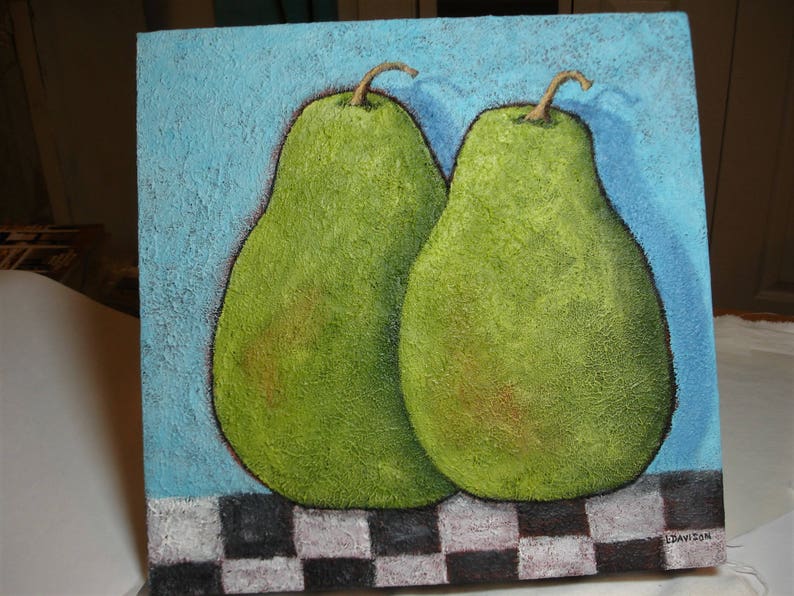 May include: A square painting featuring two green pears with brown stems against a textured light blue background. The bottom of the painting has a black and white checkered pattern. The painting is signed in the bottom right corner.