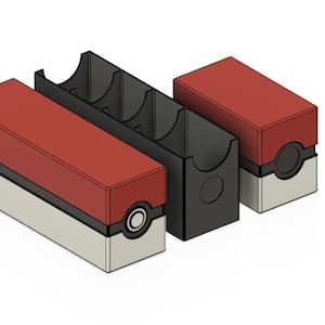 May include: A red and white box with a black and white Pokeball logo. The box is open and has three black compartments inside. The box is designed to hold trading cards.