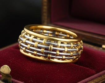 Vintage Cartier ring van 18 karaats goud en roestvrij staal, met brede mandvlecht.