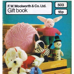 May include: A vintage knitting pattern book from Woolworth featuring a pink crocheted doily, a white poodle, a black and white spotted dog, a pink pig, a snowman, and a blue fuzzy creature. The book cover has the text "F.W. Woolworth & Co. Ltd. Gift book 503 18p".