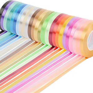 May include: A roll of colorful satin ribbon in various shades, including pink, purple, blue, green, yellow, orange, and red. The ribbon is wound around a cardboard core and is ready to be used for crafting, gift wrapping, or decorating.