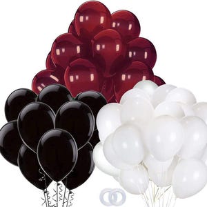 May include: A collection of red, black, and white balloons. The balloons are arranged in a pyramid shape with the red balloons at the top, the black balloons in the middle, and the white balloons at the bottom.