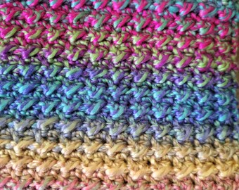 Multi-Colored Blues, PInks and a little Green Winter Scarf made with a soft yarn.  Perfect for any outside occasion.  Great gift idea.
