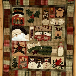 May include: A patchwork quilt with a Christmas theme. It features a variety of holiday motifs, including snowmen, gingerbread men, angels, and a cardinal. The quilt is made in a rustic style with a mix of plaid and floral fabrics. The text "Jingle" is featured in the center of the quilt.