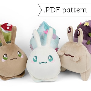 May include: Three plush snail toys with different designs. The first snail is brown with a green mushroom shell. The second snail is white with a blue and pink shell. The third snail is brown with a purple shell and flowers.  .PDF pattern