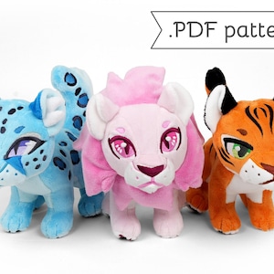 May include: Three plush animal toys: a blue leopard with purple eyes, a pink lion with pink eyes, and an orange tiger with green eyes. The toys are standing on a white surface. The text ".PDF pattern" is above the toys.