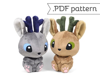 May include: Two plush toy deer with antlers, one gray with blue antlers and one brown with green antlers. Both have pink paw pads and are sitting with their paws crossed.
