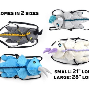 May include: Four plush dragon backpacks in different colors: gray, white, blue, and light gray. The backpacks come in two sizes: 21 inches long and 28 inches long.  The text "COMES IN 2 SIZES" is at the top of the image. The text "SMALL: 21" LONG" and "LARGE: 28" LONG" is at the bottom of the image.