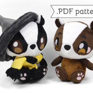 May include: Two plush badger toys, one wearing a grey witch hat and a yellow scarf, the other with brown fur.  The plush toys have large eyes and are sitting on a white surface.  .PDF pattern