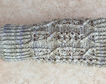 May include: A pair of knitted fingerless gloves in a light gray and purple color with a lacy pattern.