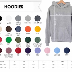 May include: A grey hooded sweatshirt with a front pocket, displayed next to a color chart featuring twenty-four circular swatches with labels and a size chart with width and length measurements in inches for sizes small through four extra large.