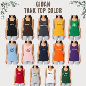 May include: A colour chart displaying fifteen sleeveless tank tops in various shades including black, brown, dark heather, gold, kelly green, light blue, light pink, navy, orange, purple, red, sport grey, white, and forest green with text labels.