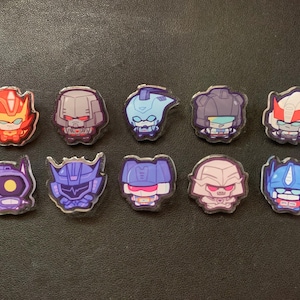 Transformers acrylic pins: Optimus, Megatron, Rodimus, Blurr, Soundwave, Shockwave, Prowl, Jazz Acrylic charm