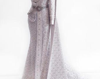 May include: A floor-length, one-shoulder silver gown featuring intricate embroidery throughout the fabric. The dress includes a fitted bodice with a decorative waist accent, a long draped side panel, and a structured silhouette displayed on a mannequin.