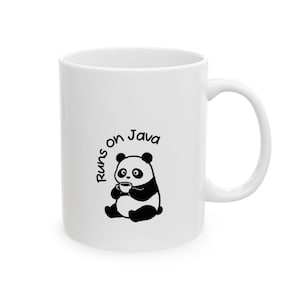 May include: A white ceramic mug featuring a black and white graphic of a seated panda holding a small cup. The text "Runs on Java" is printed in a simple black font in an arc above the panda illustration on the front of the mug.