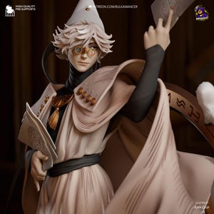 May include: A detailed figurine of a character wearing a pointed hat, round glasses, and a flowing beige robe with gold accents. The figure holds a book and a card, featuring text including 'PATREON.COM/BULKAMANCER' and 'SCULPTED BY ALEX GRAY'.