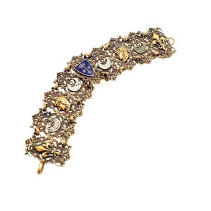Pulsera vintage de latón con filigrana de esmalte, luna y flor de lis, estilo Renacimiento egipcio.