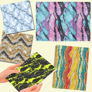 May include: Five different marble patterned notebooks with spiral binding. The notebooks have a variety of colours and patterns, including blue, pink, yellow, black, and white.