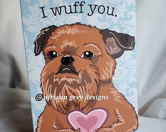 May include: A greeting card with a cartoon Brussels Griffon dog holding a pink heart. The card says "I wuff you."
