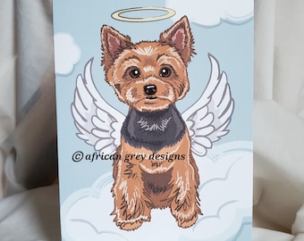 May include: A digital illustration of a Yorkshire Terrier with angel wings and a halo, sitting on a cloud. The dog is brown and black with a black collar. The background is a light blue sky with white clouds. The text "© african grey designs" is at the bottom of the image.