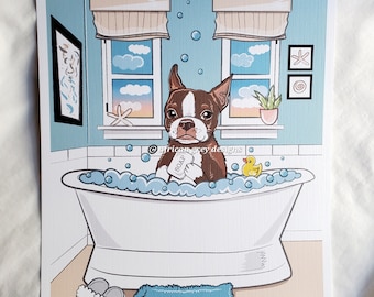 May include: A brown and white Boston Terrier dog sits in a white bathtub with blue water and bubbles. The dog is holding a bar of soap that says "SOAP". There is a yellow rubber duck in the tub. The bathroom has a blue tiled wall, a window with white blinds, and a small plant in a pot.