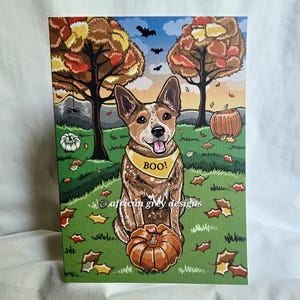 May include: A canvas print featuring a dog wearing a yellow bandana with "BOO!" printed on it, sitting in a grassy field with pumpkins and autumn leaves. The background includes trees with fall foliage, bats, and a spider web.