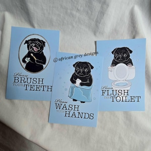 May include: Three blue bathroom signs with black pug illustrations and white text. The signs read "Please Brush Your Teeth", "Please Wash Your Hands", and "Please Flush The Toilet".